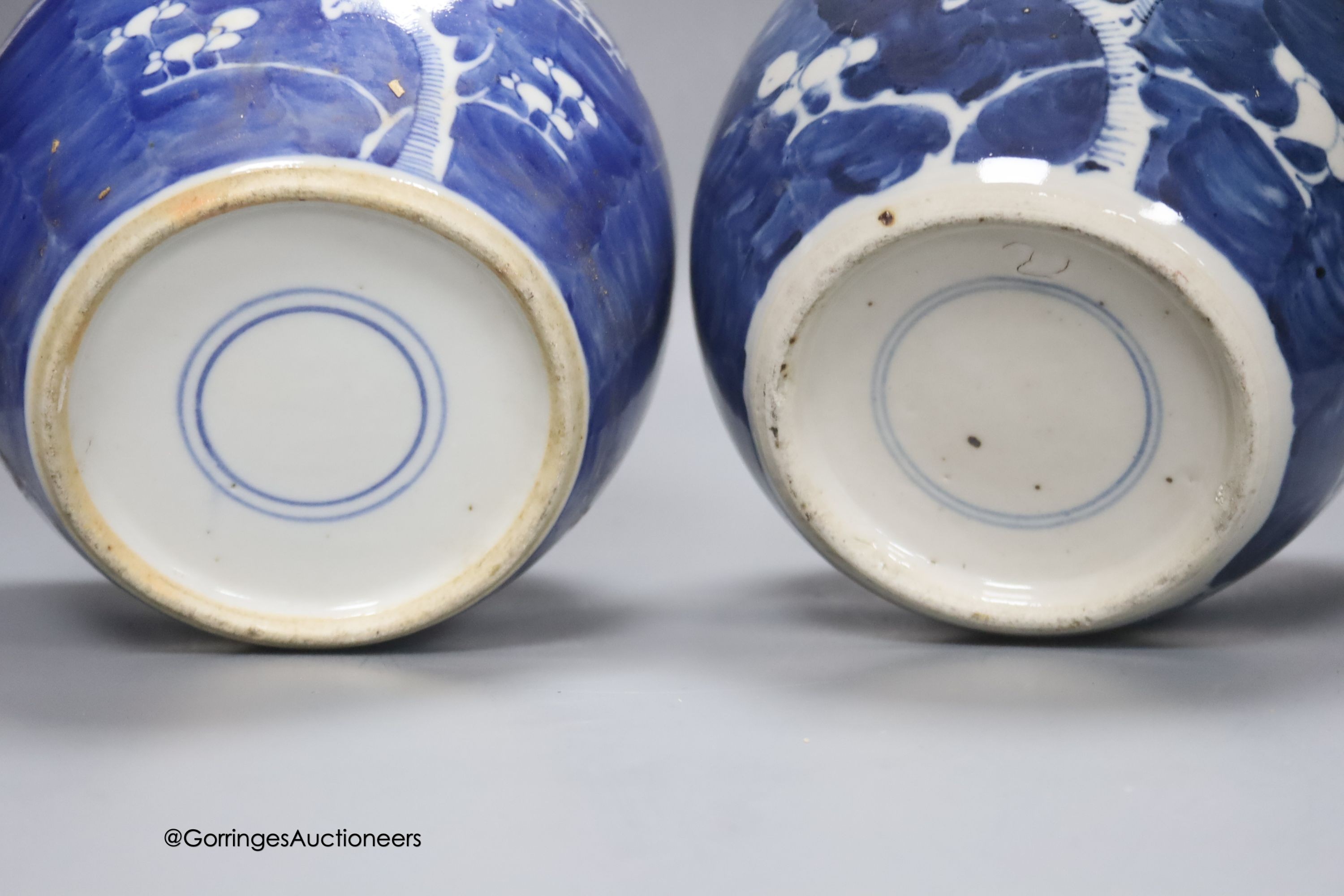 Two early 20th century Chinese blue and white prunus jars, tallest 16cm